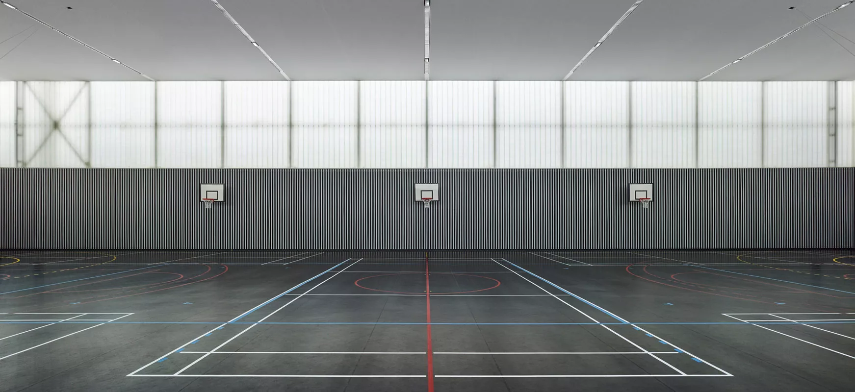 Gymnase Les Closiaux - Clamart I Bardage à claire voie BIME® I Woodenha Industries